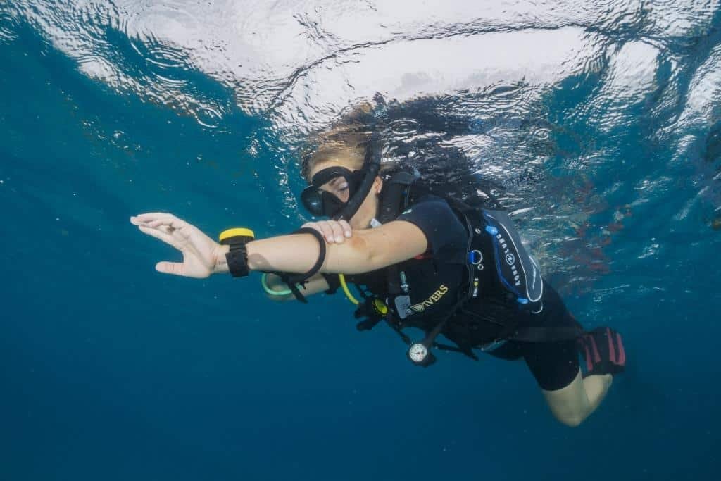 diver-doing-navigation-skills-on-the-surface