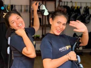 girls in wetsuits smiling 1024x768