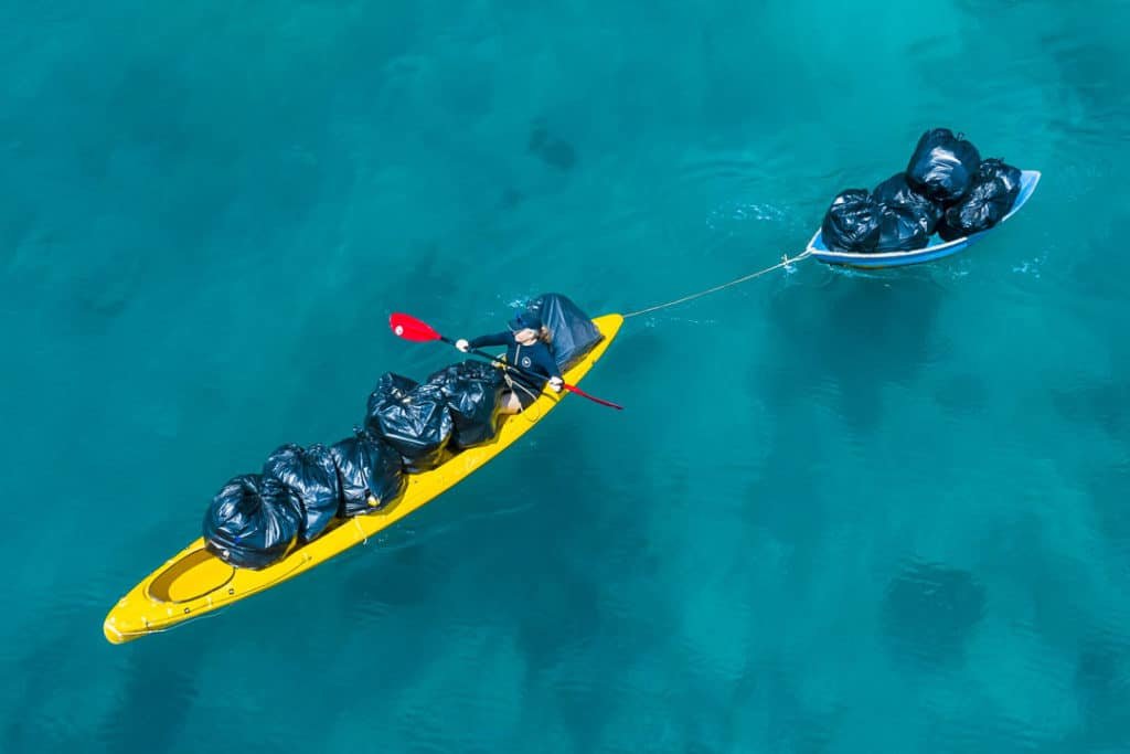 Ferrying the rubbish via kayak to the dive boat