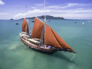 phinisi with sails up scaled